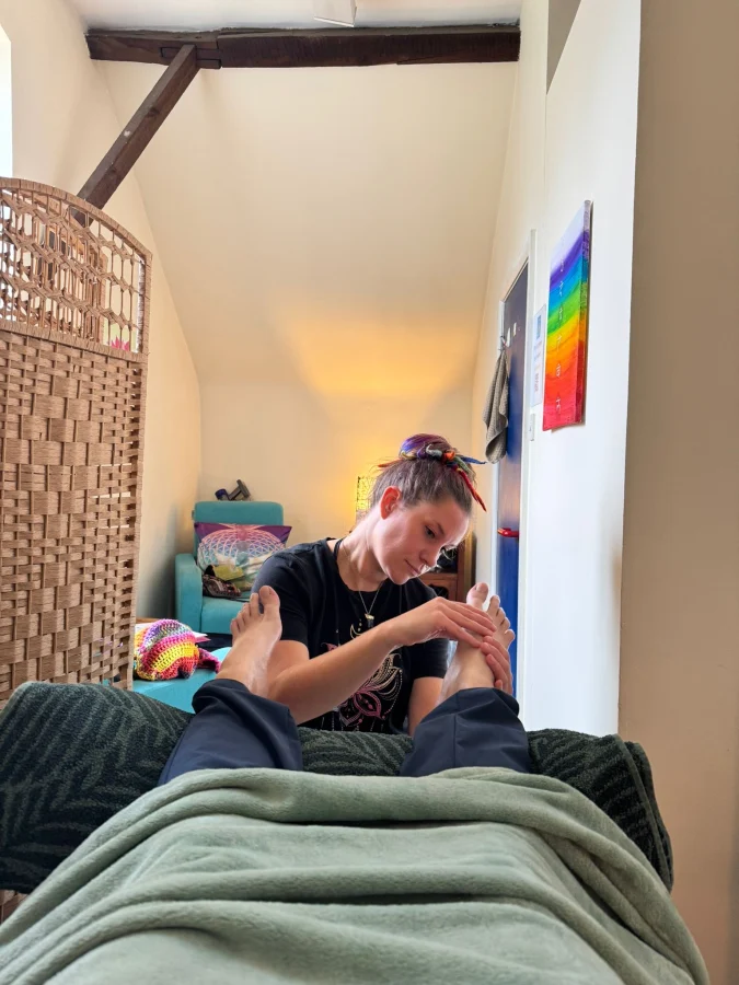 Ellie performing reflexology in her practice is Fareham